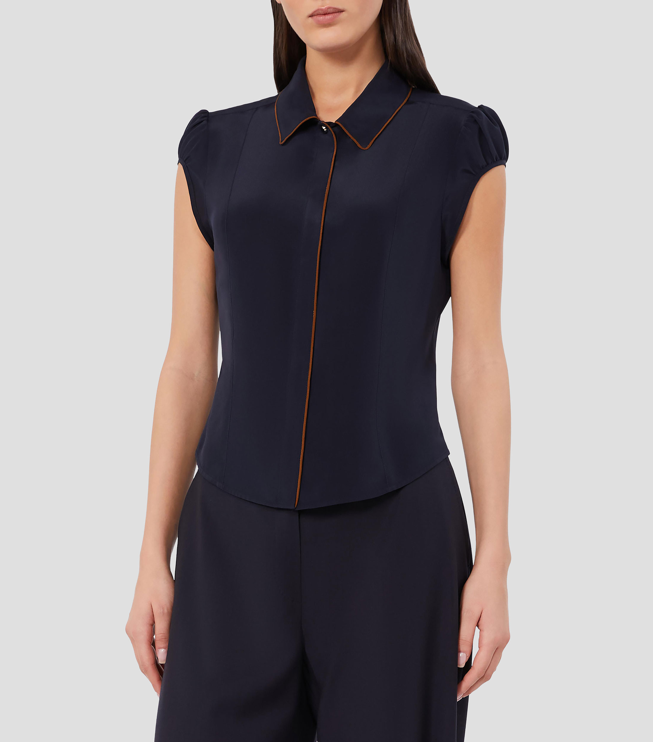 Camisa lisa sin mangas Mujer